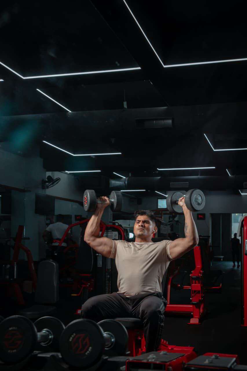 Red squat rack with punching bag